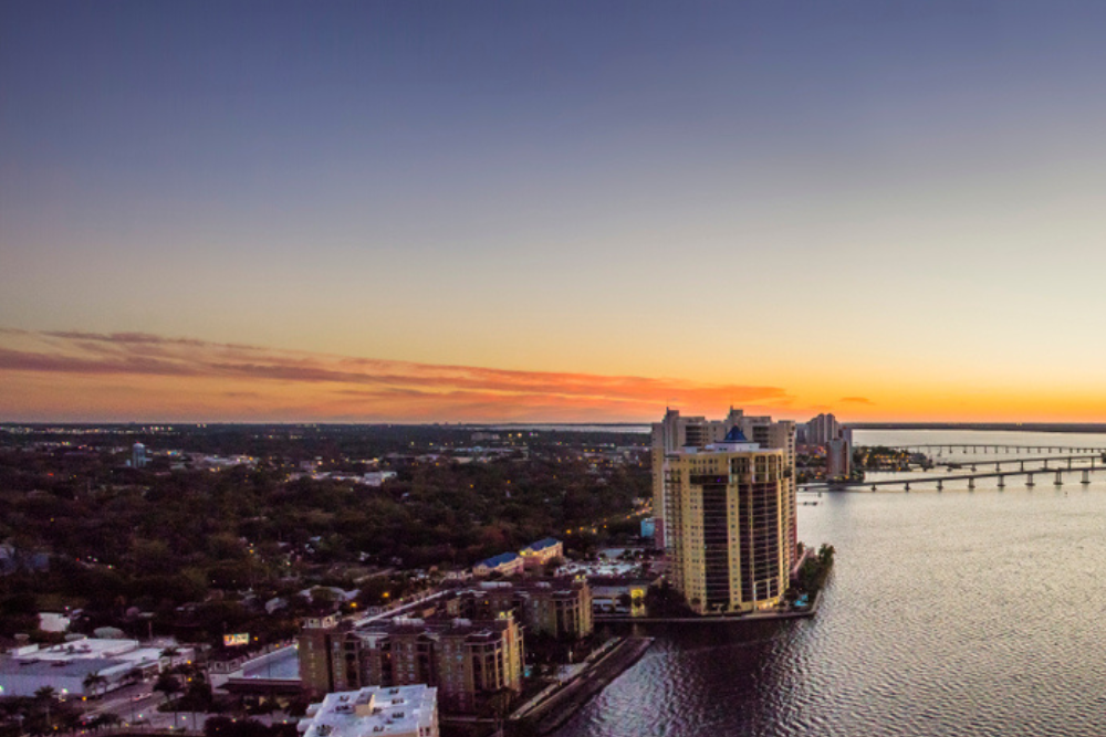 Aerial sunset view of the Caloosahatchee River and downtown Fort Myers